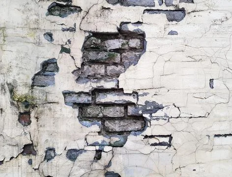 Background of a crumbling brick wall close-up Stock Photos