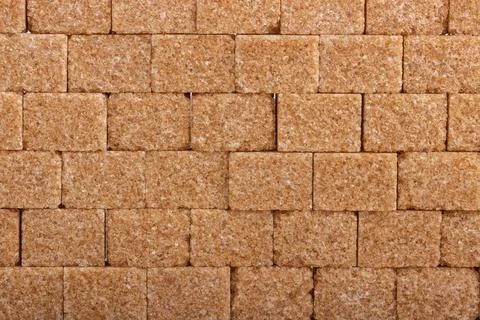 Background of cubes of cane brown sugar Stock Photos