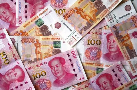 Background with currency of 100 yuan and 5000 ruble, top view Stock Photos
