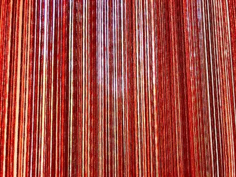 Background - curtains of threads on the window. Stock Photos