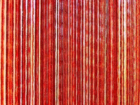 Background - curtains of threads on the window. Stock Photos
