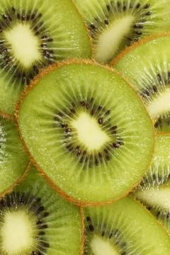 Background of cut kiwi fruit Stock Photos