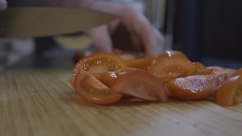 On the background of the cut tomatoes are sliced tomatoes Stock Footage 101662476