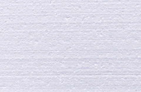 Background from cut of white foamed polystyrene. Stock Photos