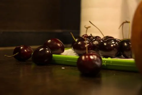 Background of dark cherries on the kitchen table Stock Photos