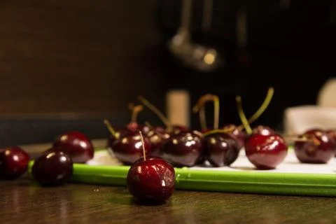 Background of dark cherries on the kitchen table Stock Photos