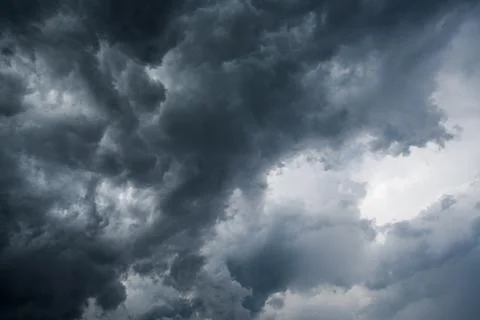 Background of dark clouds before a thunder-storm Stock Photos