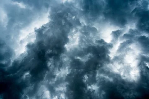 Background of dark clouds before a thunder-storm Stock Photos