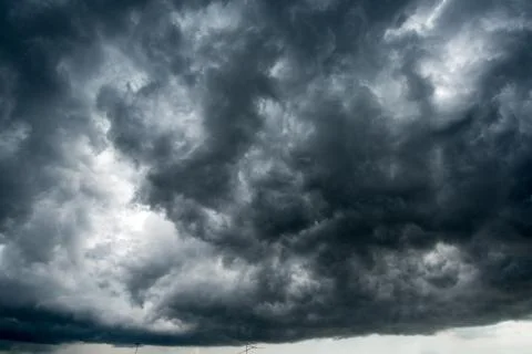 Background of dark clouds before a thunder-storm Stock Photos