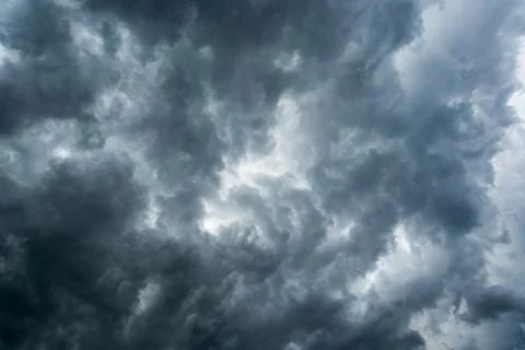 Background of dark clouds before a thunder-storm Stock Photos