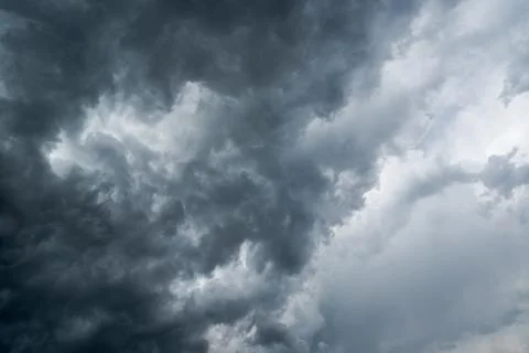 Background of dark clouds before a thunder-storm Stock Photos