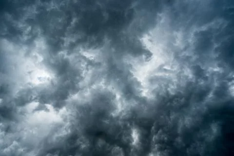 Background of dark clouds before a thunder-storm Stock Photos