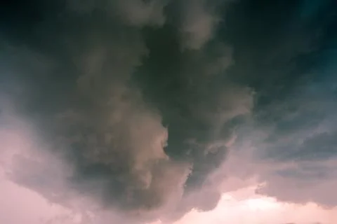 Background of dark clouds before a thunder-storm Stock Photos