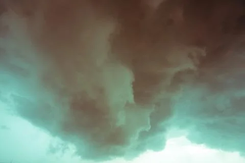 Background of dark clouds before a thunder-storm Stock Photos