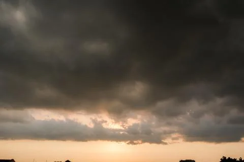 Background of dark clouds before a thunder-storm Stock Photos