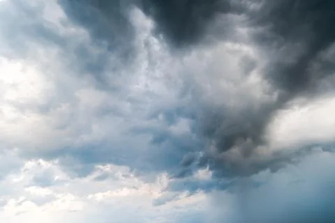 Background of dark clouds before a thunder-storm Stock Photos