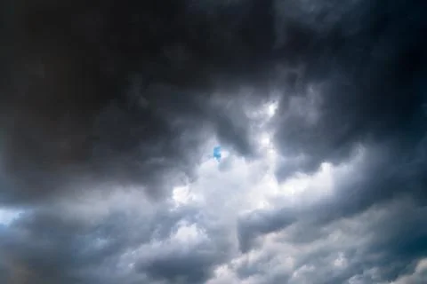 Background of dark clouds before a thunder-storm Stock Photos