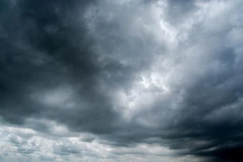 Background of dark clouds before a thunder-storm Stock Photos
