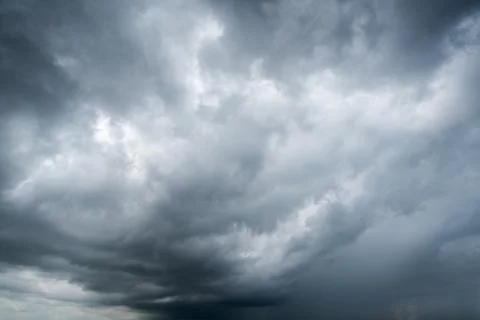 Background of dark clouds before a thunder-storm Stock Photos