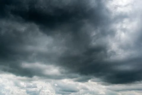 Background of dark clouds before a thunder-storm Stock Photos