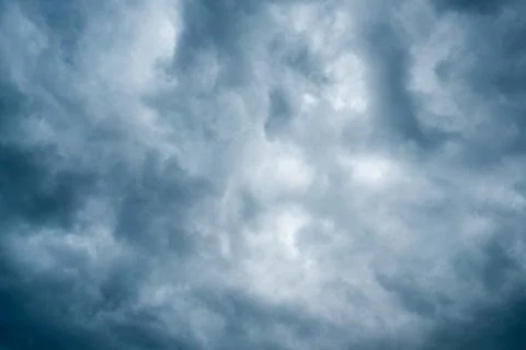 Background of dark clouds before a thunder-storm Stock Photos