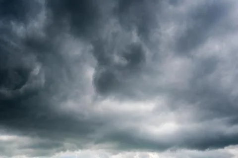 Background of dark clouds before a thunder-storm Stock Photos
