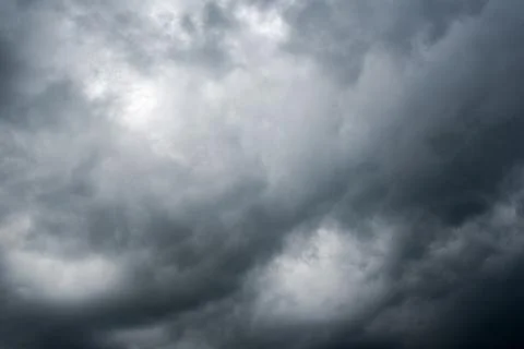 Background of dark clouds before a thunder-storm Stock Photos
