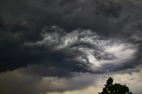 Background of dark clouds before a thunder-storm Stock Photos