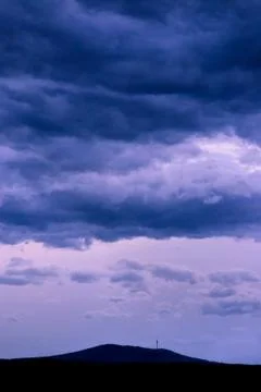Background of dark cloudy sky before a thunder-storm Stock Photos