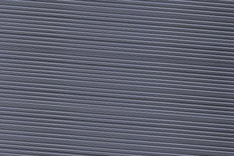 Background dark ribbed thin gray lines a lot of texture cardboard pattern. Stock Photos