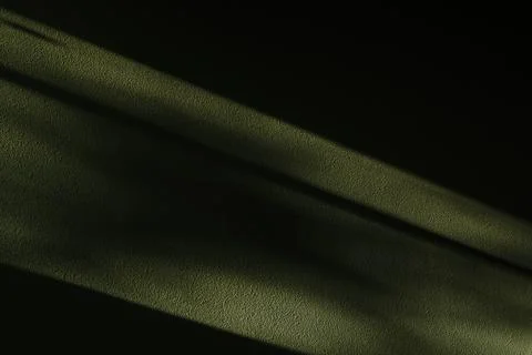 Background of a dark wall with a ray of light on it Stock Photos