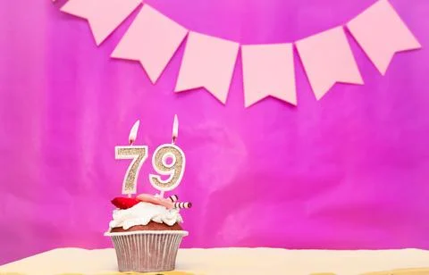 Background date of birth with number  79. Pink background with a cake and b.. Stock Photos