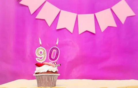 Background date of birth with number  90. Pink background with a cake and b.. Stock Photos