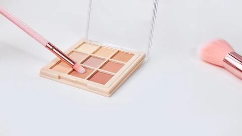 Background with decorative cosmetics on dressing table in makeup room Stock Photos