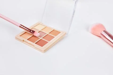 Background with decorative cosmetics on dressing table in makeup room Stock Photos