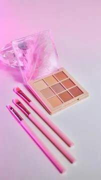 Background with decorative cosmetics on dressing table in makeup room Stock Photos