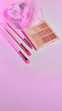 Background with decorative cosmetics on dressing table in makeup room Foto stock