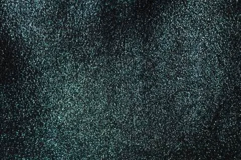 The background is a deep shiny black with silver fabric Foto stock