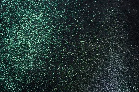 The background is a deep shiny green with gray cloth Stock Photos