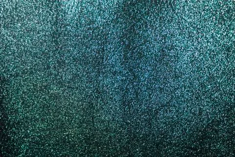 The background is a deep shiny green with gray cloth Stock Photos