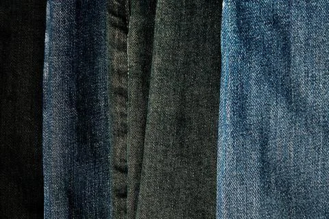 Background with denim fabric texture in different shades Stock Photos