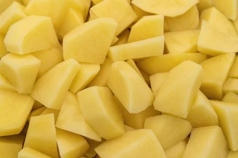 A background of diced raw potatoes Stock Photos