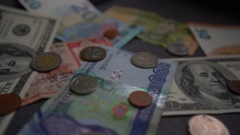 Background from different banknotes and coins of dollars, euros, rubles, and Stock Footage 236389002