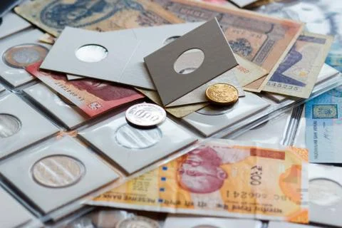Background from different coins and old banknotes Stock Photos