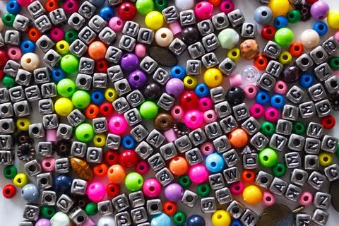 Background from different colored beads with numbers and symbols 写真素材