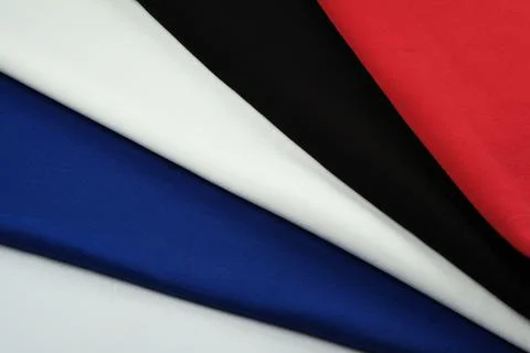 Background of different colors of fabric. Material for sewing. Stock Photos