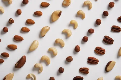 Background of different nuts on a white backdrop. Almonds, cashews, hazelnu.. Stock Photos
