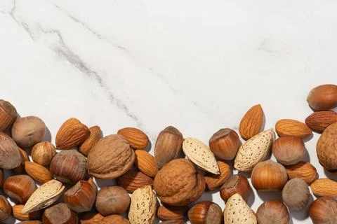 Background with different nuts on a white background Stock Photos