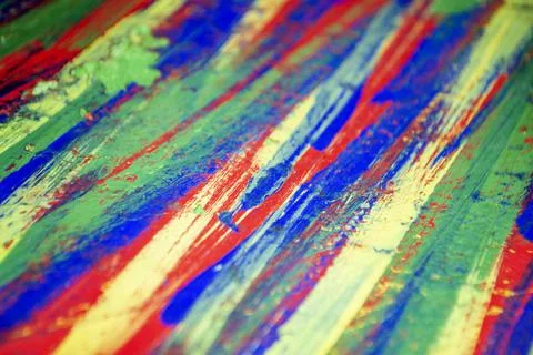 Background from different strokes of red, yellow, green and blue paint Stock Illustration