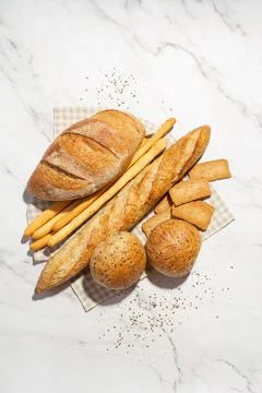 Background with different types of fresh bread. Bakery products. Cooking. Stock Photos